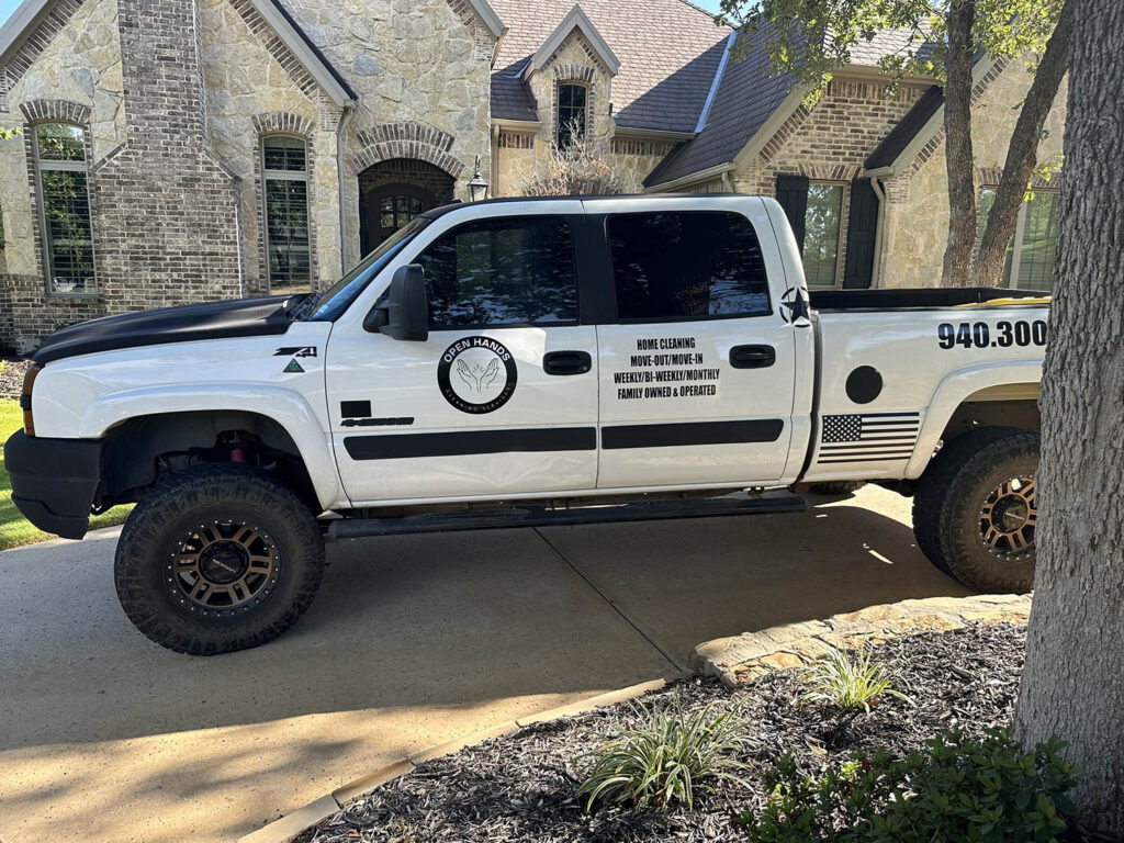 Open Hands Cleaning Services truck in a residential driveway in the DFW Metroplex