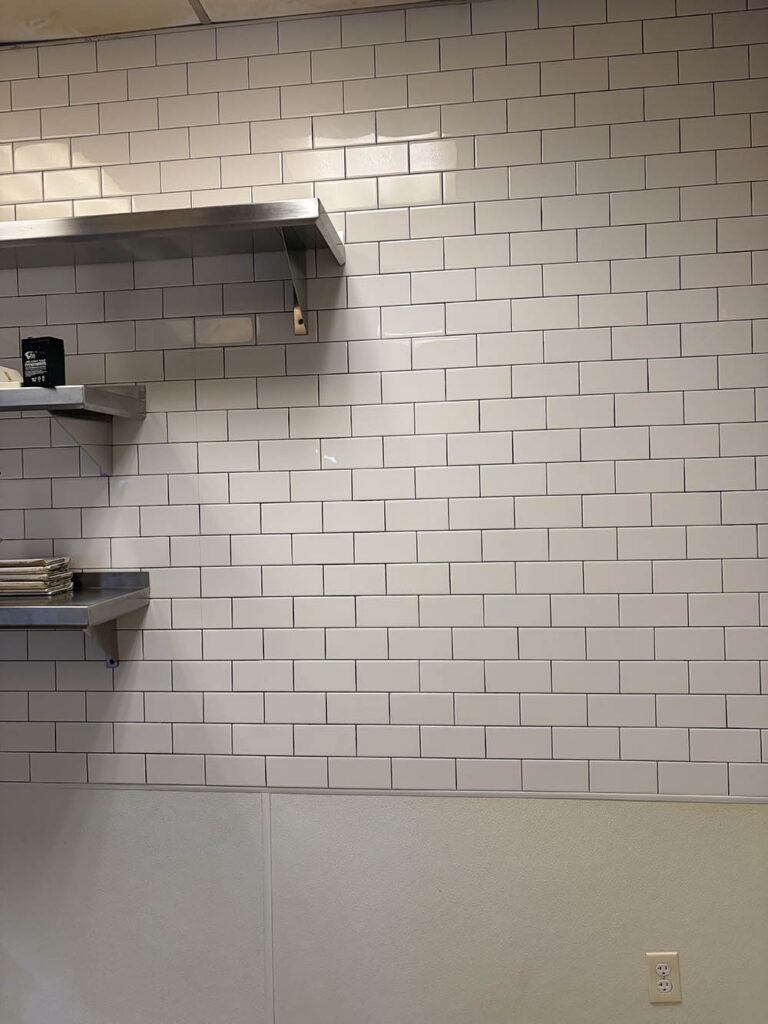 Commercial kitchen wall shelves and tile after cleaning
