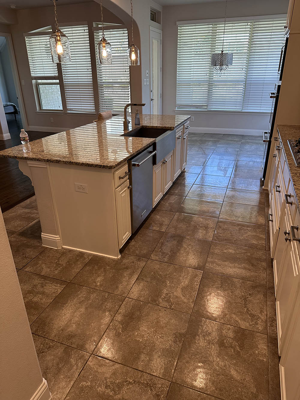 Kitchen island and polished tile floor after an Open Hands clean