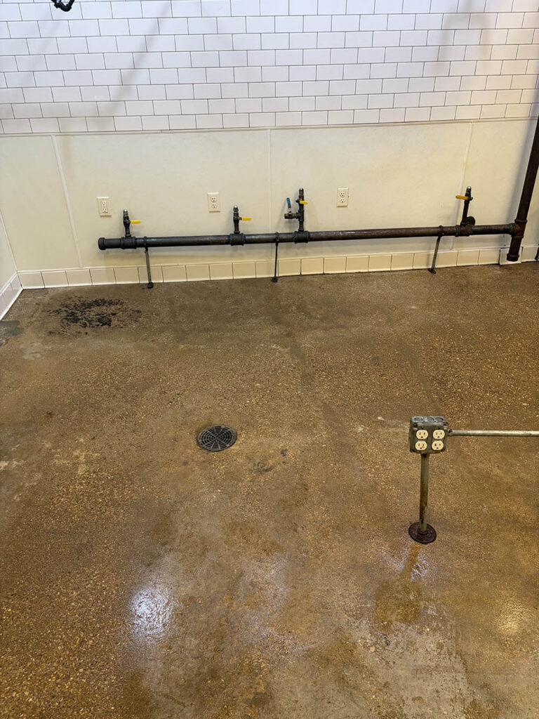 Commercial kitchen floor after mopping