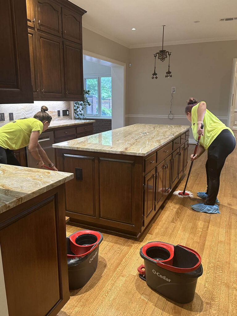 open-hands-crew-mopping-kitchen-floor-yellow-uniform-legacy