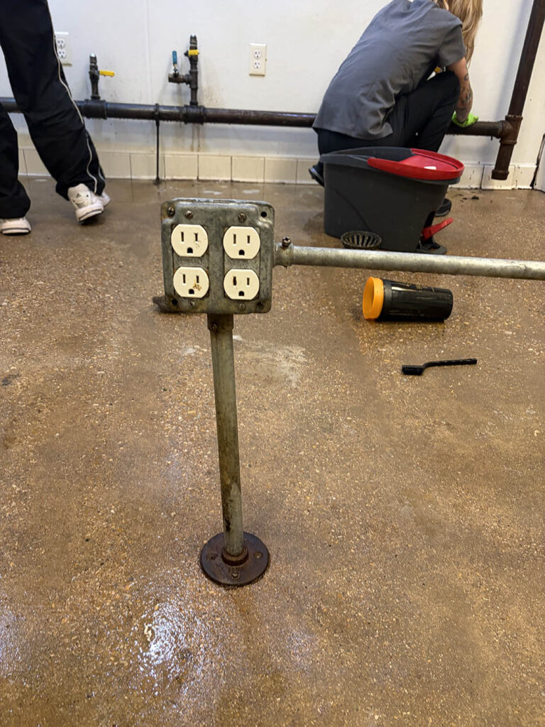 Open Hands crew scrubbing a commercial kitchen floor