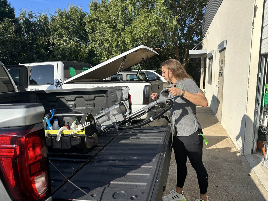 open-hands-loading-vacuum-into-truck-bed